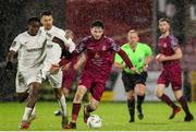 23 February 2024; Dale Holland of Cobh Ramblers in action against Carl Mujaguzi of Athlone Town during the SSE Airtricity Men's First Division match between Cobh Ramblers and Athlone Town at Turner's Cross in Cork. Photo by Michael P Ryan/Sportsfile