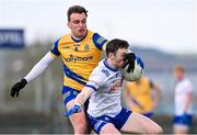 25 February 2024; Killian Lavelle of Monaghan in action against Enda Smith of Roscommon during the Allianz Football League Division 1 match between Roscommon and Monaghan at Dr Hyde Park in Roscommon. Photo by Daire Brennan/Sportsfile