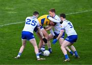 25 February 2024; Enda Smith of Roscommon in action against Michael McCarville, left, Kieran Duffy, and Killian Lavelle, right, of Monaghan during the Allianz Football League Division 1 match between Roscommon and Monaghan at Dr Hyde Park in Roscommon. Photo by Daire Brennan/Sportsfile