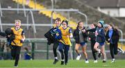 25 February 2024; Roscommon supporters run onto the field after the Allianz Football League Division 1 match between Roscommon and Monaghan at Dr Hyde Park in Roscommon. Photo by Daire Brennan/Sportsfile