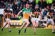 25 February 2024; Charlie Mitchell of Offaly races clear of John Donnelly of Kilkenny, 12, during the Allianz Hurling League Division 1 Group A match between Kilkenny and Offaly at UPMC Nowlan Park in Kilkenny. Photo by Ray McManus/Sportsfile