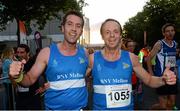 10 September 2013; Conor McGuinness, left, and Eric Champ, BNY Mellon, after competing in the Grant Thornton 5k Corporate Team Challenge 2013. Dublin Docklands, Dublin. Photo by Sportsfile