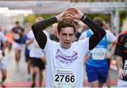 10 September 2013; Aidan Byrne, running for Tech Group, in the Grant Thornton 5k Corporate Team Challenge 2013. Dublin Docklands, Dublin. Photo by Sportsfile