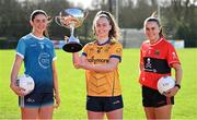 29 February 2024; Emma Duggan of DCU, centre, with Rachel Brennan of TUD, left, and Kelly Ann Hogan of UCC and the O'Connor Cup during the LGFA Higher Education Football Championships Captains Day at MTU Cork. Photo by Brendan Moran/Sportsfile