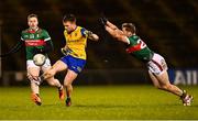 2 March 2024; Niall Daly of Roscommon in action against Cillian O'Connor, left, and Eoghan McLaughlin of Mayo during the Allianz Football League Division 1 match between Mayo and Roscommon at Hastings Insurance MacHale Park in Castlebar, Mayo. Photo by Piaras Ó Mídheach/Sportsfile