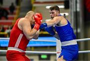 6 March 2024; Martin McDonagh of Ireland, right, in action against Yusuf Acik of Türkiye during their Men's 92kg+ Round of 32 bout during day four at the Paris 2024 Olympic Boxing Qualification Tournament at E-Work Arena in Busto Arsizio, Italy. Photo by Ben McShane/Sportsfile