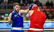 6 March 2024; Martin McDonagh of Ireland in action against Yusuf Acik of Türkiye, right, during their Men's 92kg+ Round of 32 bout during day four at the Paris 2024 Olympic Boxing Qualification Tournament at E-Work Arena in Busto Arsizio, Italy. Photo by Ben McShane/Sportsfile