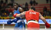 6 March 2024; Thomas Vianney Mboua of Cameroon, left, in action against Dohyeon Kim of Republic of Korea during their Men's 92kg+ Round of 32 bout during day four at the Paris 2024 Olympic Boxing Qualification Tournament at E-Work Arena in Busto Arsizio, Italy. Photo by Ben McShane/Sportsfile