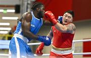 6 March 2024; Thomas Vianney Mboua of Cameroon, left, in action against Dohyeon Kim of Republic of Korea during their Men's 92kg+ Round of 32 bout during day four at the Paris 2024 Olympic Boxing Qualification Tournament at E-Work Arena in Busto Arsizio, Italy. Photo by Ben McShane/Sportsfile