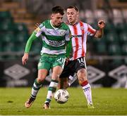 4 March 2024; Darragh Burns of Shamrock Rovers in action against Ben Doherty of Derry City during the SSE Airtricity Men's Premier Division match between Shamrock Rovers and Derry City at Tallaght Stadium in Dublin. Photo by Stephen McCarthy/Sportsfile