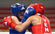 8 March 2024; Daina Moorehouse of Ireland, left, in action against Tayonis Cedeno of Venezuela during their Women's 50kg Round of 32 bout against during day six at the Paris 2024 Olympic Boxing Qualification Tournament at E-Work Arena in Busto Arsizio, Italy. Photo by Ben McShane/Sportsfile