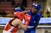 8 March 2024; Yi-Xuan Guo of Chinese Taipei, left, in action against Janet Acquah of Ghana during their Women's 50kg Round of 32 bout during day six at the Paris 2024 Olympic Boxing Qualification Tournament at E-Work Arena in Busto Arsizio, Italy. Photo by Ben McShane/Sportsfile