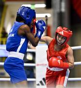 8 March 2024; Yi-Xuan Guo of Chinese Taipei, right, in action against Janet Acquah of Ghana during their Women's 50kg Round of 32 bout during day six at the Paris 2024 Olympic Boxing Qualification Tournament at E-Work Arena in Busto Arsizio, Italy. Photo by Ben McShane/Sportsfile