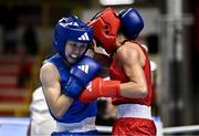 8 March 2024; Elise Glynn of Great Britain, right, in action against Zichun Xu of China during their Women's 57kg Round of 32 bout during day six at the Paris 2024 Olympic Boxing Qualification Tournament at E-Work Arena in Busto Arsizio, Italy. Photo by Ben McShane/Sportsfile