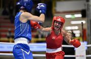 8 March 2024; Elise Glynn of Great Britain, right, in action against Zichun Xu of China during their Women's 57kg Round of 32 bout during day six at the Paris 2024 Olympic Boxing Qualification Tournament at E-Work Arena in Busto Arsizio, Italy. Photo by Ben McShane/Sportsfile