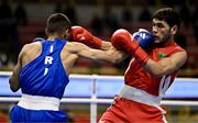 8 March 2024; Shakur Ovezov of Turkmenistan, right, in action against Daniyal Shahbakhsh of Iran during their Men's 57kg Round of 32 bout during day six at the Paris 2024 Olympic Boxing Qualification Tournament at E-Work Arena in Busto Arsizio, Italy. Photo by Ben McShane/Sportsfile