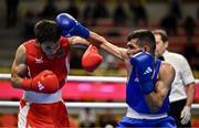 8 March 2024; Shakur Ovezov of Turkmenistan, left, in action against Daniyal Shahbakhsh of Iran during their Men's 57kg Round of 32 bout during day six at the Paris 2024 Olympic Boxing Qualification Tournament at E-Work Arena in Busto Arsizio, Italy. Photo by Ben McShane/Sportsfile