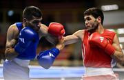 8 March 2024; Shakur Ovezov of Turkmenistan, right, in action against Daniyal Shahbakhsh of Iran during their Men's 57kg Round of 32 bout during day six at the Paris 2024 Olympic Boxing Qualification Tournament at E-Work Arena in Busto Arsizio, Italy. Photo by Ben McShane/Sportsfile