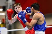 8 March 2024; Jude Gallagher of Ireland, left, in action against Uddin Mohammed Hussam of India during their Men's 57kg Round of 32 bout during day six at the Paris 2024 Olympic Boxing Qualification Tournament at E-Work Arena in Busto Arsizio, Italy. Photo by Ben McShane/Sportsfile