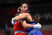 9 March 2024; Sofia Micaela Robles of Argentina, left, and Shera Mae Patricio of USA embrace after their Women's 54kg Round of 16 bout during day seven at the Paris 2024 Olympic Boxing Qualification Tournament at E-Work Arena in Busto Arsizio, Italy. Photo by Ben McShane/Sportsfile