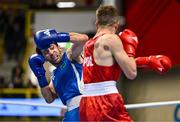 9 March 2024; Bartlomiej Roskowicz of Poland, right, in action against Saparmyrat Roskowicz of Turkmenistan during their Men's 63.5kg Round of 16 bout during day seven at the Paris 2024 Olympic Boxing Qualification Tournament at E-Work Arena in Busto Arsizio, Italy. Photo by Ben McShane/Sportsfile