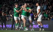 9 March 2024; James Lowe of Ireland celebrates after scoring his side's second try, in 73rd minute, with teammates Jack Crowley and Conor Murray during the Guinness Six Nations Rugby Championship match between England and Ireland at Twickenham Stadium in London, England. Photo by David Fitzgerald/Sportsfile
