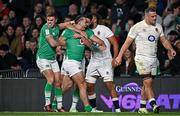 9 March 2024; James Lowe of Ireland celebrates with Jack Crowley, left, and Conor Murray, after scoring their side's second try, in 73rd minute, during the Guinness Six Nations Rugby Championship match between England and Ireland at Twickenham Stadium in London, England. Photo by Harry Murphy/Sportsfile