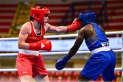 9 March 2024; Grainne Walsh of Ireland, left, in action against Asiko Friza Anyango of Kenya during their Women's 66kg Round of 16 bout during day seven at the Paris 2024 Olympic Boxing Qualification Tournament at E-Work Arena in Busto Arsizio, Italy. Photo by Ben McShane/Sportsfile