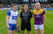 10 March 2024; Referee Colm Lyons with James Barron of Waterford and Simon Donohoe of Wexford before the Allianz Hurling League Division 1 Group A match between Waterford and Wexford at Walsh Park in Waterford. Photo by Seb Daly/Sportsfile