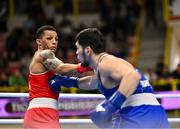 11 March 2024; Kelyn Cassidy of Ireland, left, in action against Nurbek Oralbay of Kazakhstan during their Men's 80kg Quarterfinals bout during day nine at the Paris 2024 Olympic Boxing Qualification Tournament at E-Work Arena in Busto Arsizio, Italy. Photo by Ben McShane/Sportsfile