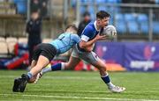 13 March 2024; Cathal Bishop of St Mary’s College is tackled by Joshua Divilly of St Michael’s College during the Bank of Ireland Schools Junior Cup semi-final match between St Michael's College and St Mary's College at Energia Park in Dublin. Photo by Daire Brennan/Sportsfile