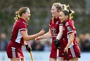 17 March 2024; Hannah Matthews of Loreto HC, centre, celebrates with team-mates Aisling Murray, left, and Mia Jennings after scoring their side's second goal during the Jacqui Potter Cup final match between UCD LHC and Loreto HC at Three Rock Rovers Hockey Club in Rathfarnham, Dublin. Photo by Tyler Miller/Sportsfile