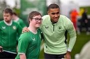 19 March 2024; Republic of Ireland goalkeeper Gavin Bazunu with David Crawford, from Donegal Town, of the Ireland Down Syndrome Futsal squad on a visit to a Republic of Ireland training session at the FAI National Training Centre in Abbotstown, Dublin. Photo by Stephen McCarthy/Sportsfile