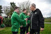 19 March 2024; Republic of Ireland technical advisor Brian Kerr meets Fergus Cosgrove, from Navan, Meath of the Ireland Down Syndrome Futsal squad on a visit to a Republic of Ireland training session at the FAI National Training Centre in Abbotstown, Dublin. Photo by Stephen McCarthy/Sportsfile
