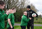 19 March 2024; Republic of Ireland interim head coach John O'Shea meets Daniel O'Reilly, from Letterkenny, Donegal, of the Ireland Down Syndrome Futsal squad on a visit to a Republic of Ireland training session at the FAI National Training Centre in Abbotstown, Dublin. Photo by Stephen McCarthy/Sportsfile