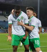 22 March 2024; Sinclair Armstrong of Republic of Ireland celebrates after scoring his side's first goal with team-mate Andrew Moran, 10, during the UEFA European Under-21 Championship qualifier match between San Marino and Republic of Ireland at San Marino Stadium in Serravalle, San Marino. Photo by Roberto Bregani/Sportsfile