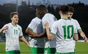 22 March 2024; Sinclair Armstrong of Republic of Ireland, centre, celebrates after scoring his side's first goal with team-mates Andrew Moran, 10, and Tayo Adaramola, hidden, Tony Springett, 11, and Anselmo García MacNulty, right, during the UEFA European Under-21 Championship qualifier match between San Marino and Republic of Ireland at San Marino Stadium in Serravalle, San Marino. Photo by Roberto Bregani/Sportsfile
