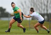 24 March 2024; Michelle Guckian of Leitrim in action against Yvonne Lee of Limerick during the Lidl LGFA National League Division 4 semi-final match between Leitrim and Limerick at Pádraig Pearses GAA Club in Roscommon. Photo by Seb Daly/Sportsfile