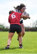 27 March 2024; Saoirse Guinan of Midlands is tackled by Katieanne Bobbett of North East during the BearingPoint Sarah Robinson Cup Round 5 match between Midlands and North East at Carlow Institute of Technology in Carlow. Photo by Tyler Miller/Sportsfile