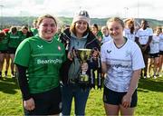27 March 2024; Majella Robison, centre, mother of the late Sarah Robinson presents the cup to South East captain Shannon Codd and Midlands captain Caoimhe McCormack after the BearingPoint Sarah Robinson Cup Round 5 match between Midlands and North East at Carlow Institute of Technology in Carlow. Photo by Tyler Miller/Sportsfile