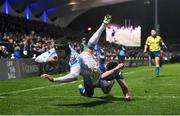 29 March 2024; Kurt-Lee Arendse of Vodacom Bulls scores his side's first try, despite the tackle of Leinster's Luke McGrath, during the United Rugby Championship match between Leinster and Vodacom Bulls at the RDS Arena in Dublin. Photo by Seb Daly/Sportsfile