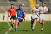 14 September 2013; Cathal O'Connell, Clare, races clear of Stephan McAfee, Antrim. Bord Gáis Energy GAA Hurling Under 21 All-Ireland 'A' Championship Final, Antrim v Clare, Semple Stadium, Thurles, Co. Tipperary. Picture credit: Brendan Moran / SPORTSFILE