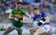 30 March 2024; Evan O'Carroll of Laois is tackled by Mark Diffley of Leitrim during the Allianz Football League Division 4 final match between Laois and Leitrim at Croke Park in Dublin. Photo by Shauna Clinton/Sportsfile