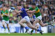 30 March 2024; Damon Larkin of Laois in action against Pearce Dolan of Leitrim during the Allianz Football League Division 4 final match between Laois and Leitrim at Croke Park in Dublin. Photo by Shauna Clinton/Sportsfile