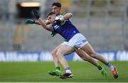 30 March 2024; Evan O'Carroll of Laois in action against Mark Diffley of Leitrim during the Allianz Football League Division 4 final match between Laois and Leitrim at Croke Park in Dublin. Photo by Shauna Clinton/Sportsfile