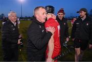 30 March 2024; Derry manager Johnny McGarvey celebrates with Corey O'Reilly of Derry after their victory in the Allianz Hurling League Division 2B final match between Derry and Tyrone at the Derry GAA Centre of Excellence in Owenbeg, Derry. Photo by Ben McShane/Sportsfile