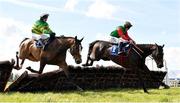 31 March 2024; Lucky Lyreen, right, with Danny Gilligan up, jumps the last on their way to winning the Cawley Furniture Novice Handicap Hurdle, from eventual second place Buachaillbocht, left, with Mark Walsh up, on day two of the Fairyhouse Easter Festival at Fairyhouse Racecourse in Ratoath, Meath. Photo by Seb Daly/Sportsfile