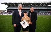 31 March 2024; Cruz Atkinson and Cillian Hanrahan, referees of the Cumann na mBunscol halftime games, were honoured on behalf of their whole team for their joint contributions this year and were recognised by  at half time of Sunday’s Allianz Football League Division 1 Final between Dublin and Derry. Pictured is Cruz Atkinson, with Uachtarán Chumann Lúthchleas Gael Jarlath Burns and Mark Brennan, Head of Market Management at Allianz Insurance. Photo by Ramsey Cardy/Sportsfile