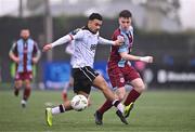 1 April 2024; Warren Davis of Drogheda United in action against Sam Durrant of Dundalk during the SSE Airtricity Men's Premier Division match between Dundalk and Drogheda United at Oriel Park in Dundalk, Louth. Photo by Ben McShane/Sportsfile