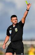 1 April 2024; Referee Rob Hennessy shows a yellow card to Robbie McCourt of Waterford, not pictured, during the SSE Airtricity Men's Premier Division match between Waterford and Shamrock Rovers at the Regional Sports Centre in Waterford. Photo by Tyler Miller/Sportsfile